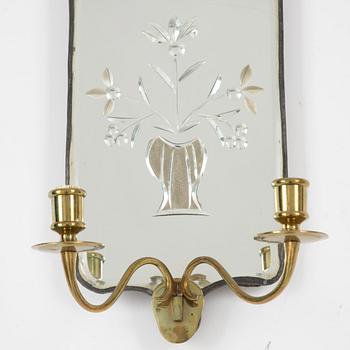 A pair of Swedish rococo engraved glass two-branch girandole mirrors, later part 18th century and later.