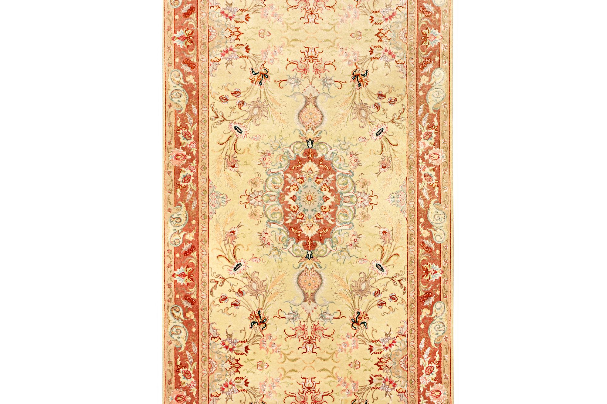 A Tabriz carpet, part silk, 50 raj, a. 508 x 85 cm.