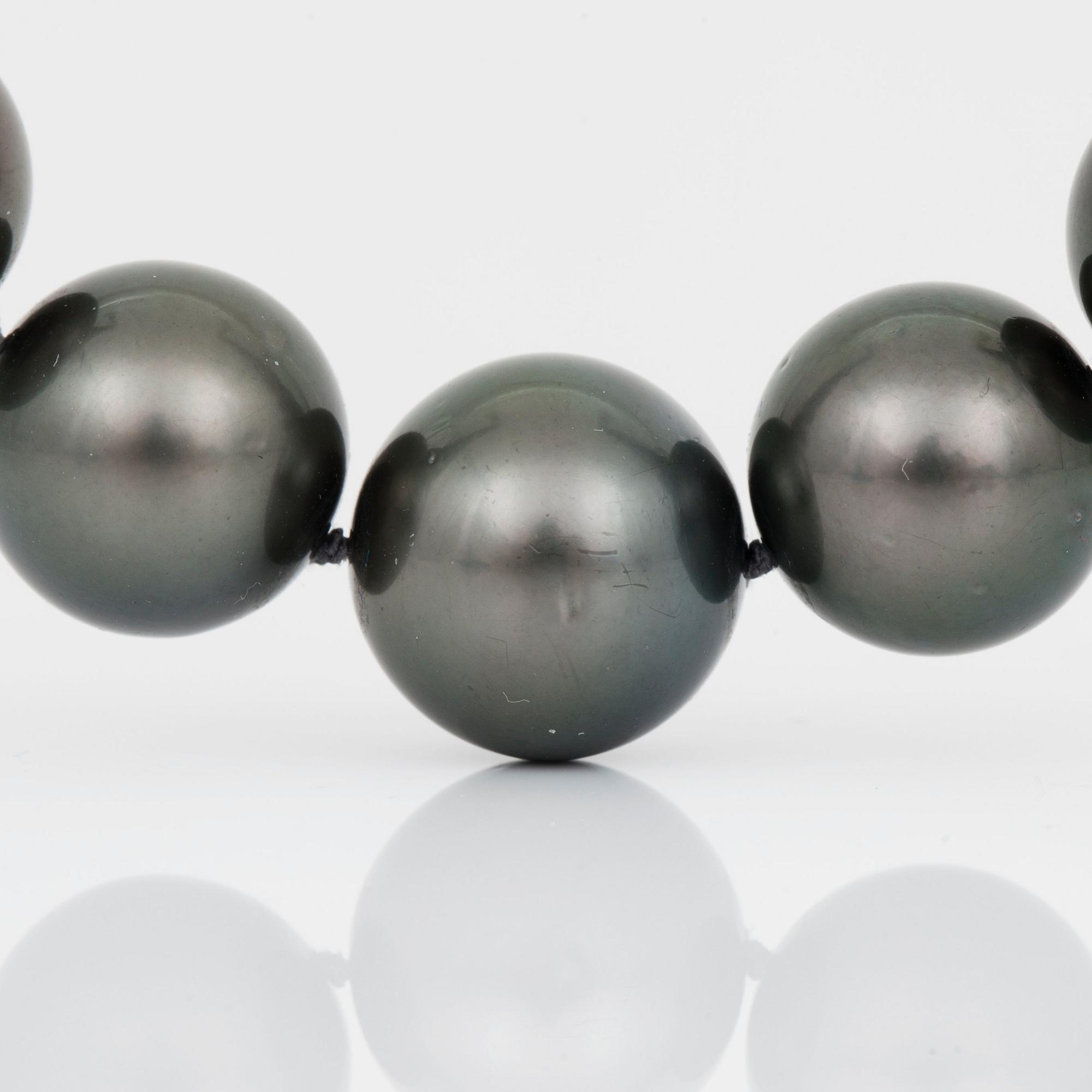 A cultured Tahiti pearl and brilliant-cut diamond necklace.