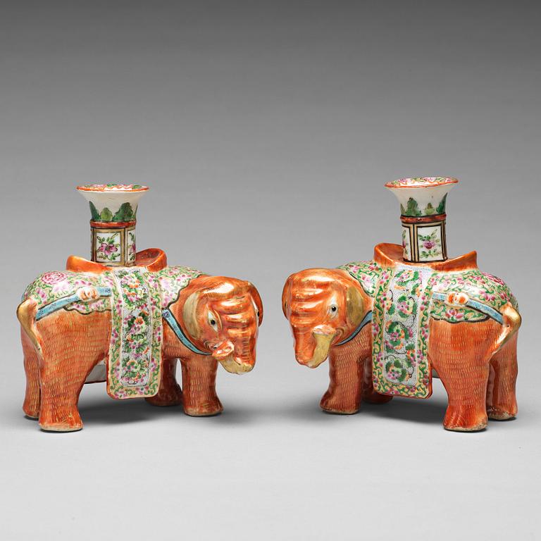 A pair of famille rose Canton elephant candle holders, late Qing dynasty, about 1900.