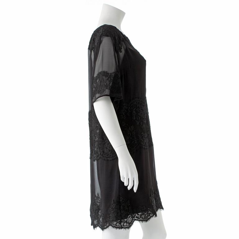 DOLCE GABBANA, a black lace dress.