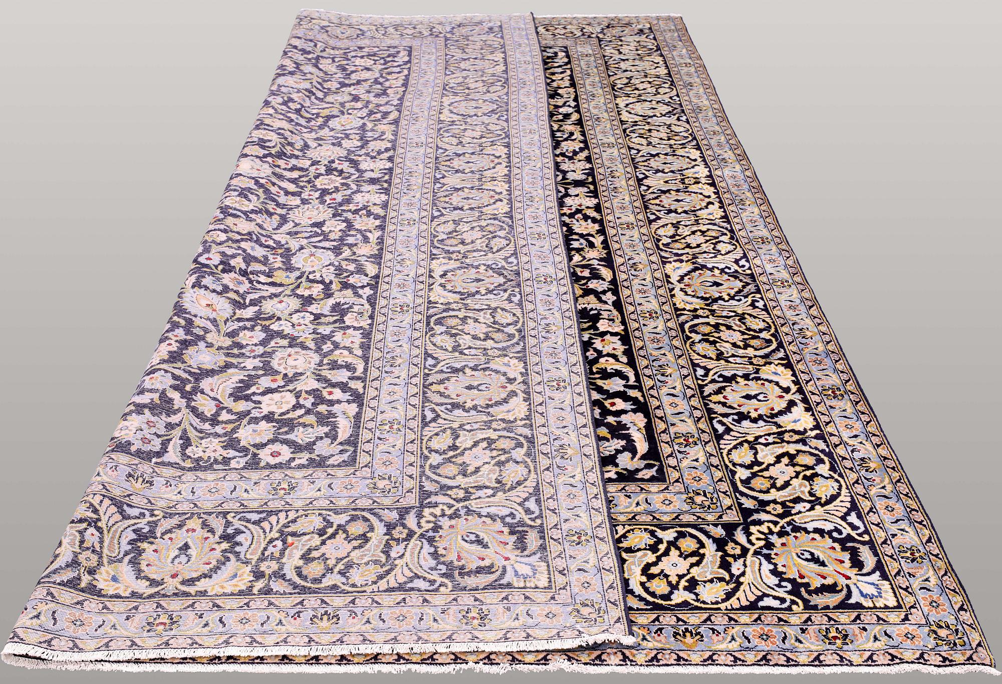 A carpet, Kashan, signed, ca 410 x 292 cm.