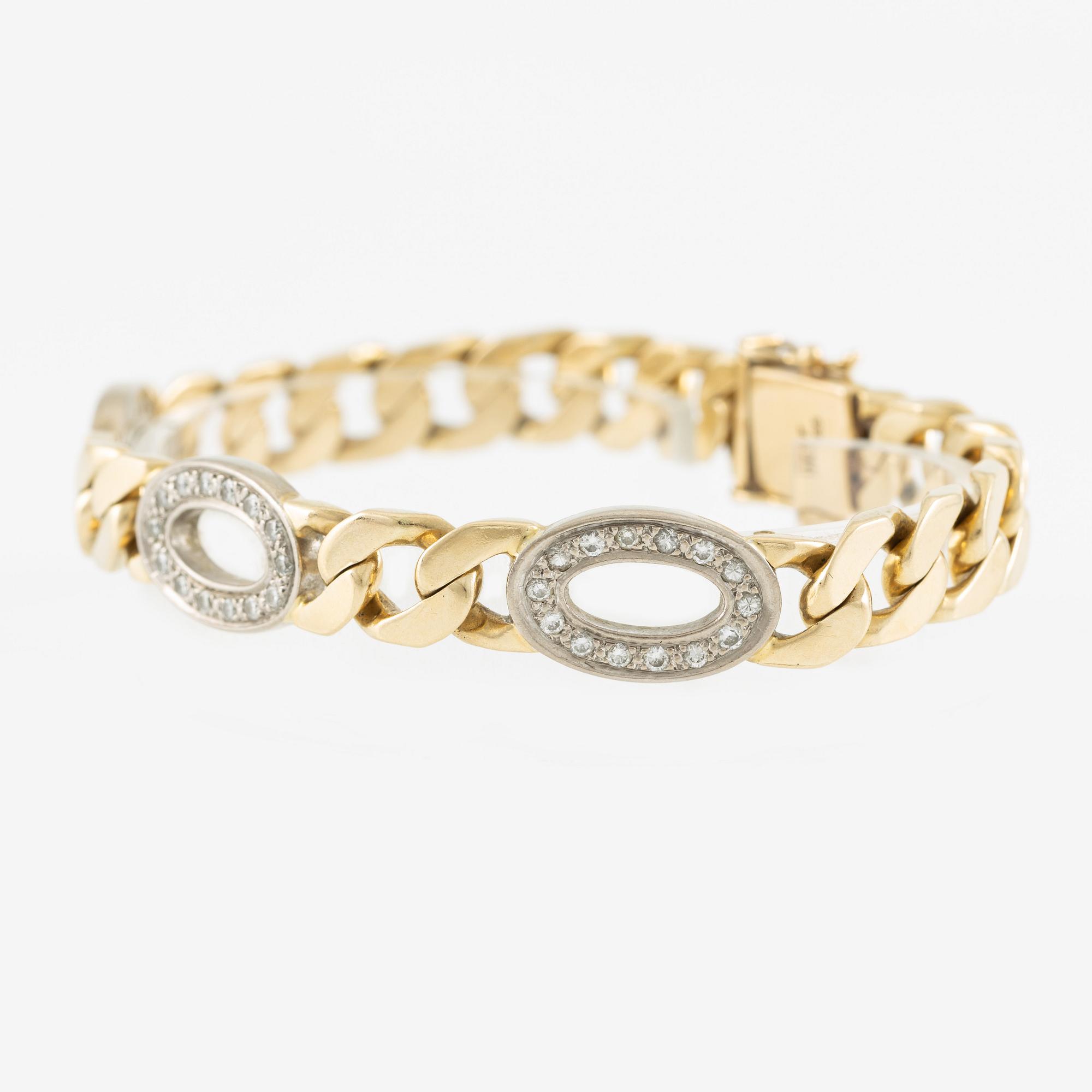 Arm bracelet, 14K gold with brilliant-cut diamonds.
