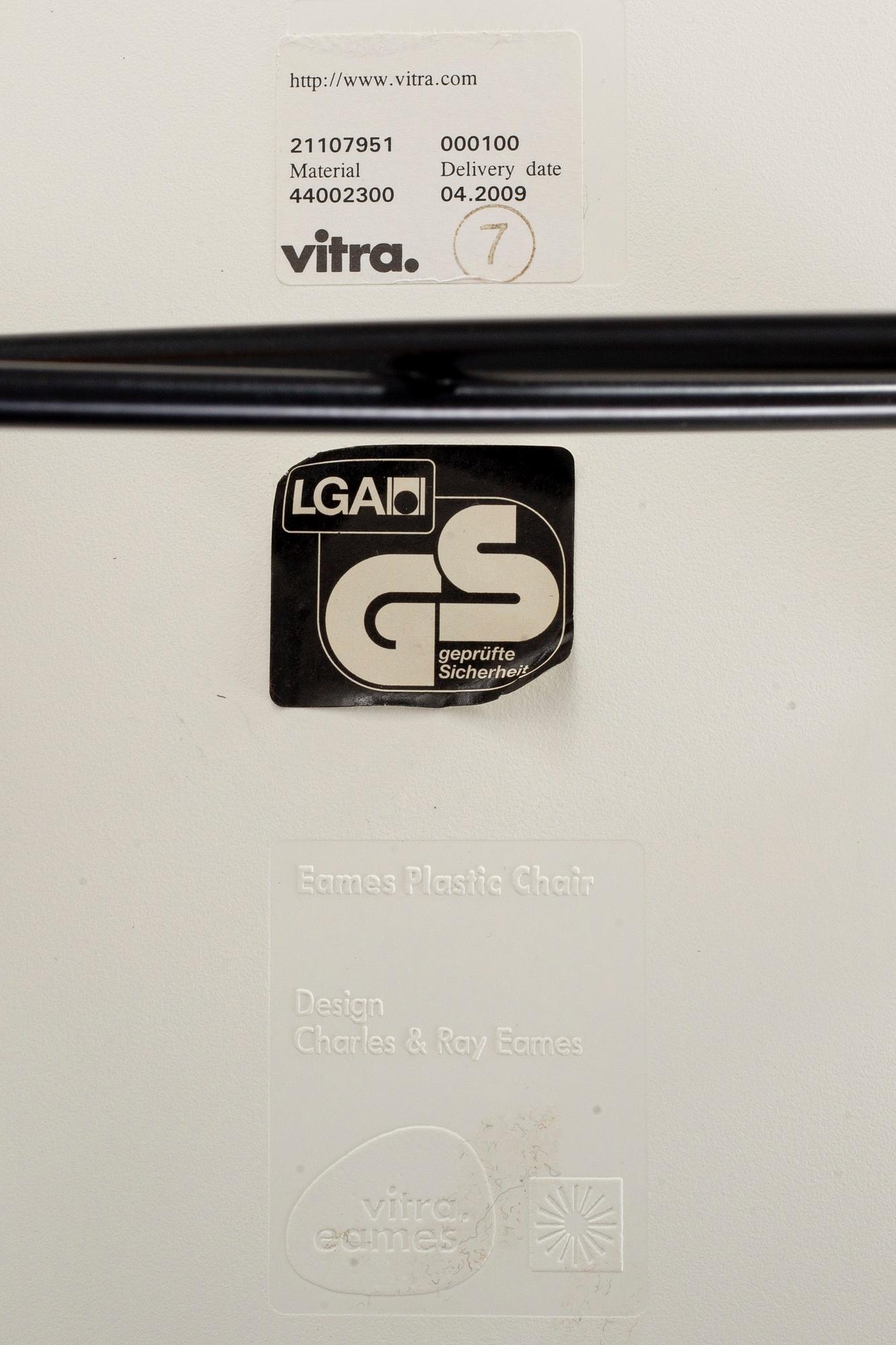 A PAIR OF "PLASTIC CHAIR" BY CHARLES & RAY EAMES, Vitra 2009.