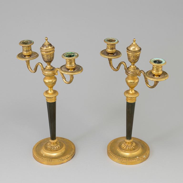 A pair of French Directoire late 18th century ormolu candelabra for three candles.