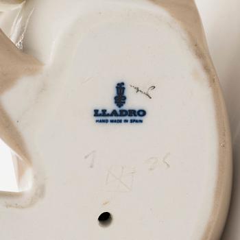 Lladró, two porcelain figurines, Donkey in Love and Trumpeting Elephant.