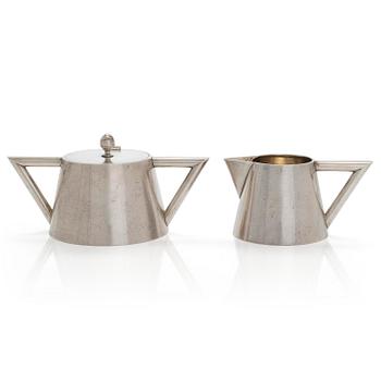 K. Fabergé, a silver sugar bowl and cream jug, Imperial Warrant mark, Moscow ca. 1913.