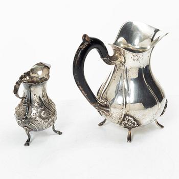 Two silver jugs, one English.