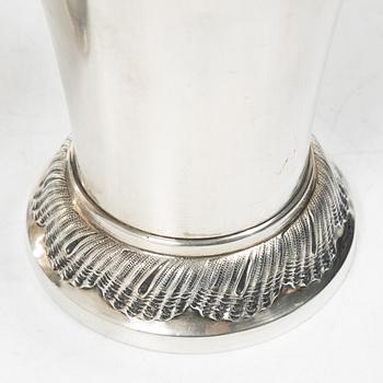 Two silver beakers and a bowl,