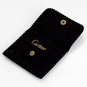 A pair of Cartier cufflinks in 18K gold and onyx.