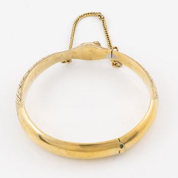 Armring in the form of a serpent, 18K gold with garnets as eyes, Johan Gustaf Kihlberg, Nyköping 1863.