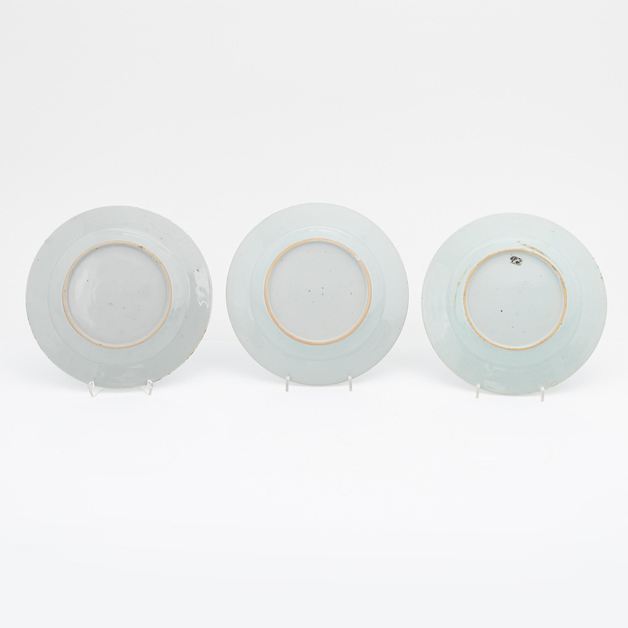 A blue and white serving dish and eight odd plates, Qing dynasty, 18th Century.