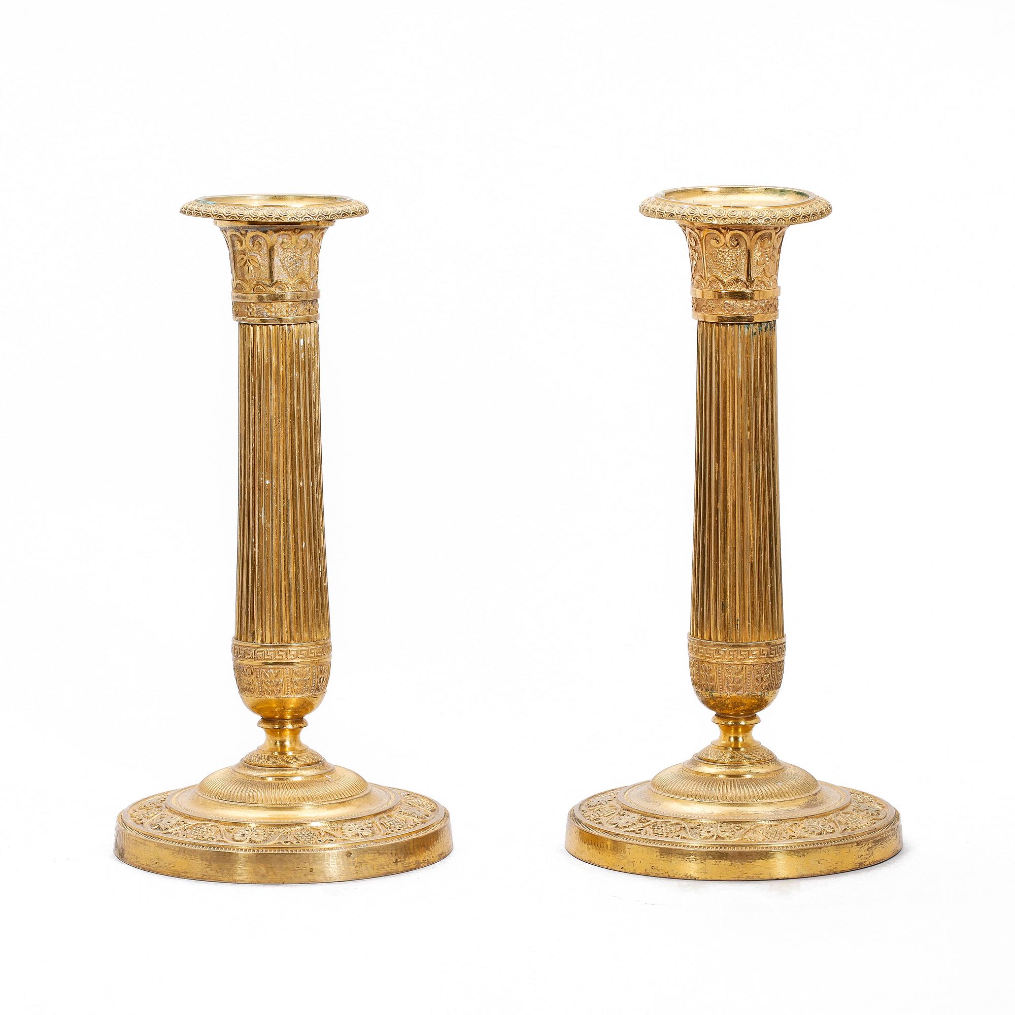 LJUSSTAKAR, ett par, empire, brons, 1800-talets första hälft.