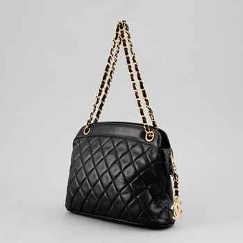 Chanel, a black quilted leather handbag, 1980's.