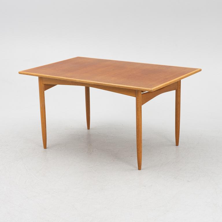 A teak and oak dining table, Scandinavia, 1960's.