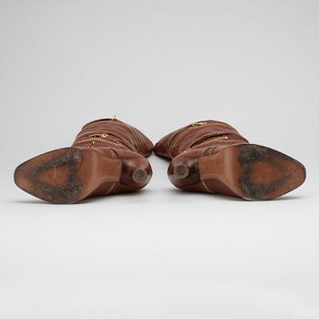 ALEXANDER MCQUEEN, a pair of brown leather boots.