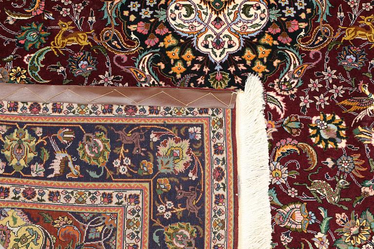A part silk Tabriz rug, so-called 50 Radj, approx. 200 x 148 cm.