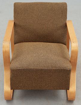 An Alvar Aalto laminated birch 'padded Paimio chair', upholstered in yellow and black fabric.