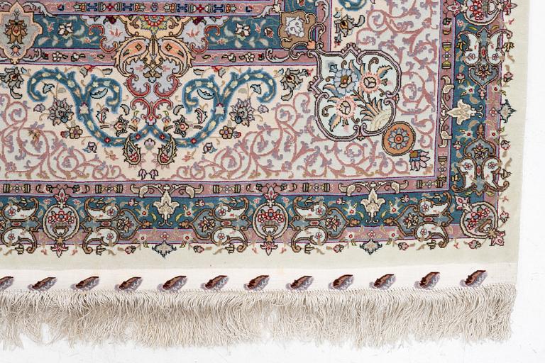 A Tabriz, carpet, 310 x 195 cm. signed.