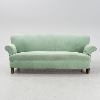 A mid 20th Century sofa and easy chair.