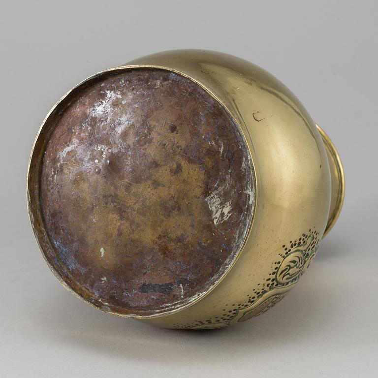 A 19th century brass champagne cooler.