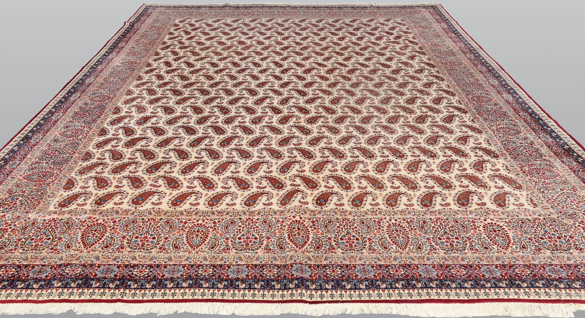 A Kirman carpet, signed, c. 390 x 295 cm.