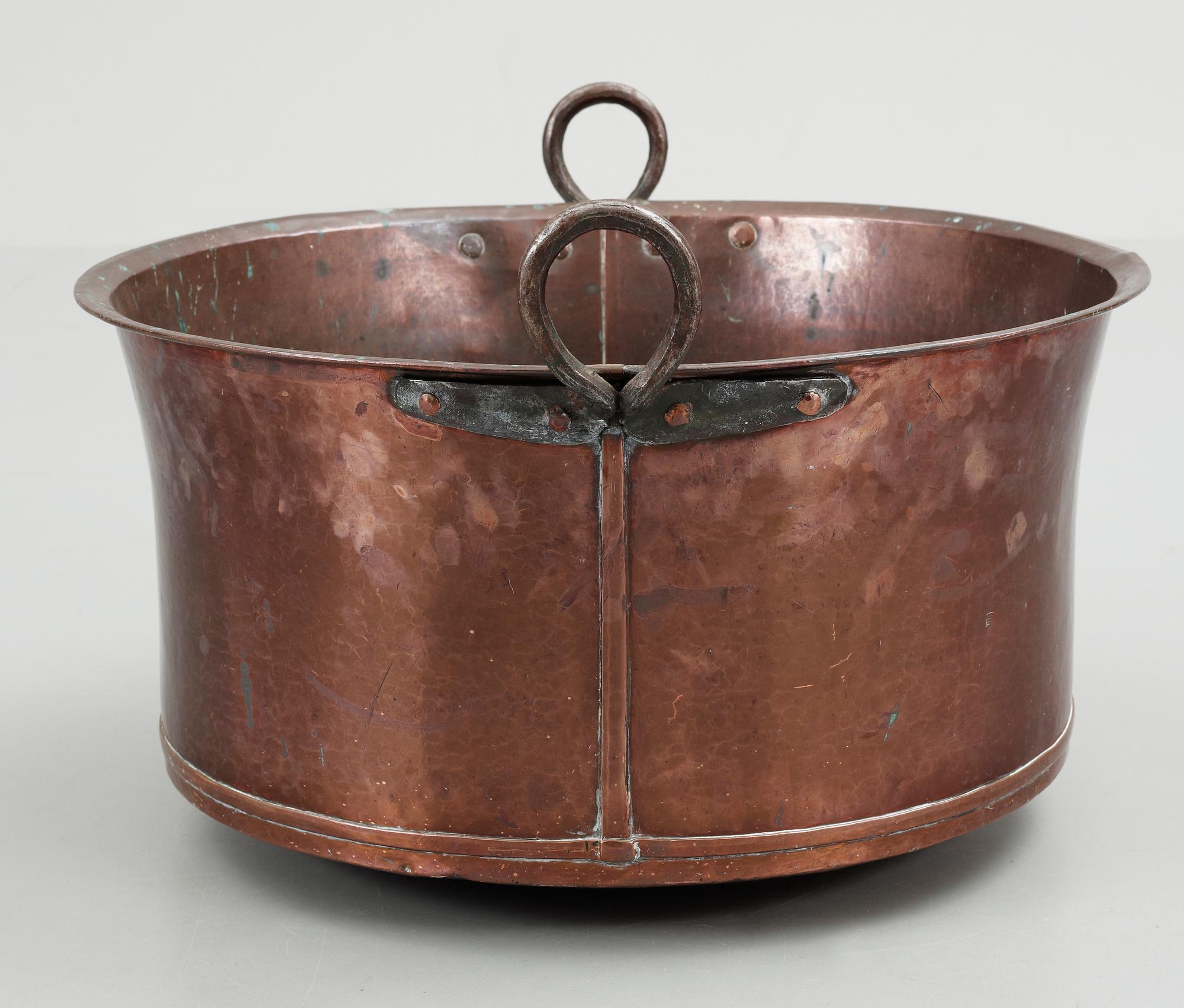 A late 19th century copper cauldron.