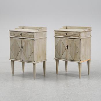 A pair of Gustavian style bedside tables, first half of the 20th century,.