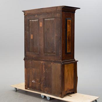 An 18th century oak and walnut cabinet.