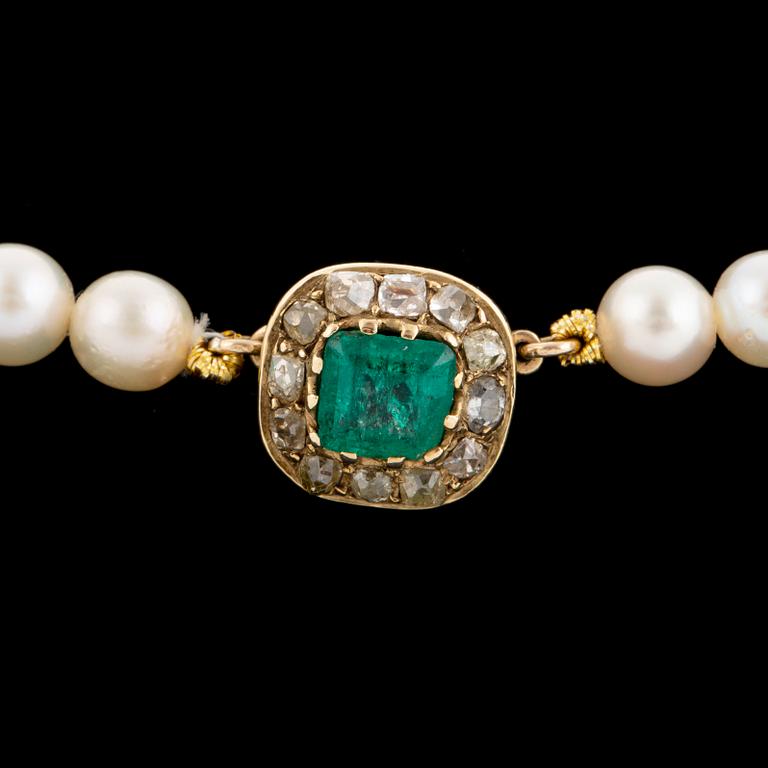 Cultured calibrated pearl necklace, clasp with emerald and old-cut diamonds.
