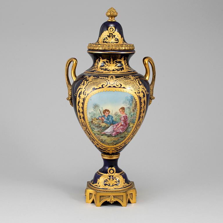 A French porcelain and gilt bronze urn with cover, 20th century.