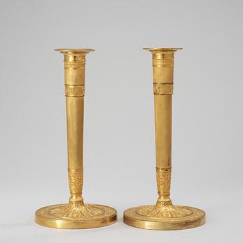 A pair of French Empire early 19th century candlesticks.