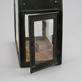 An 18th century tinplate and glass lantern.