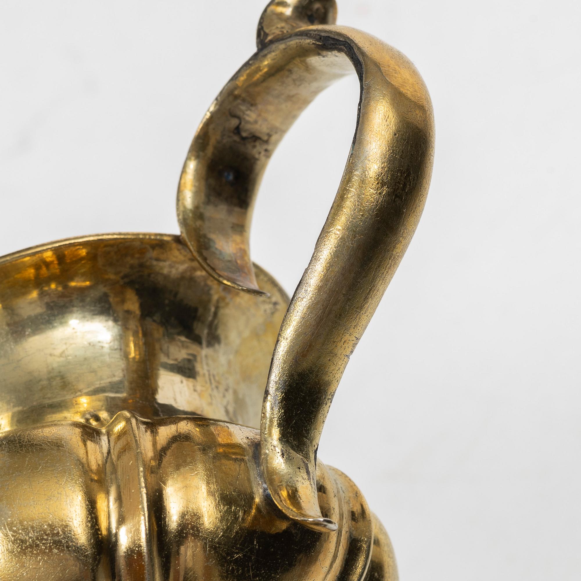 A Russian silver-gilt cream jug, Minsk, 1860s.