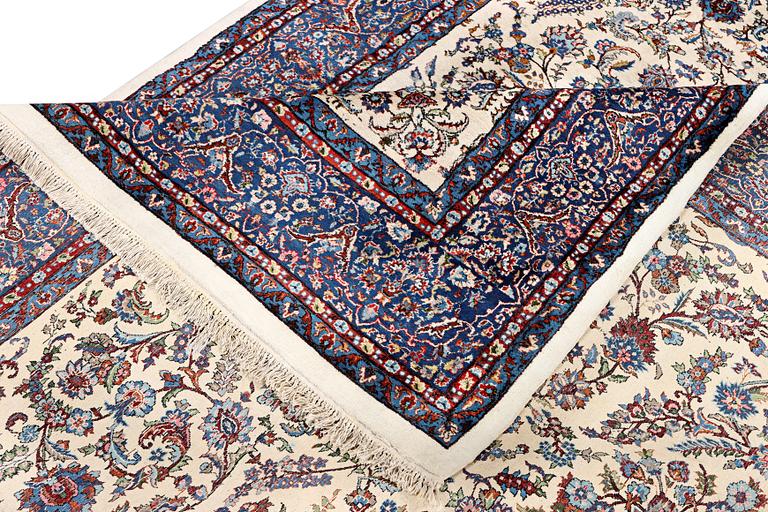 An oriental carpet, c. 308 x 220 cm.