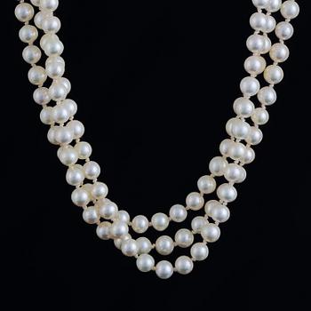 Three strand cultured pearl necklace, clasp with diamonds.