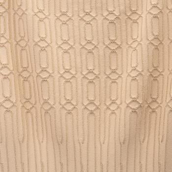 Alaïa, a beige patterned dress, size 36.