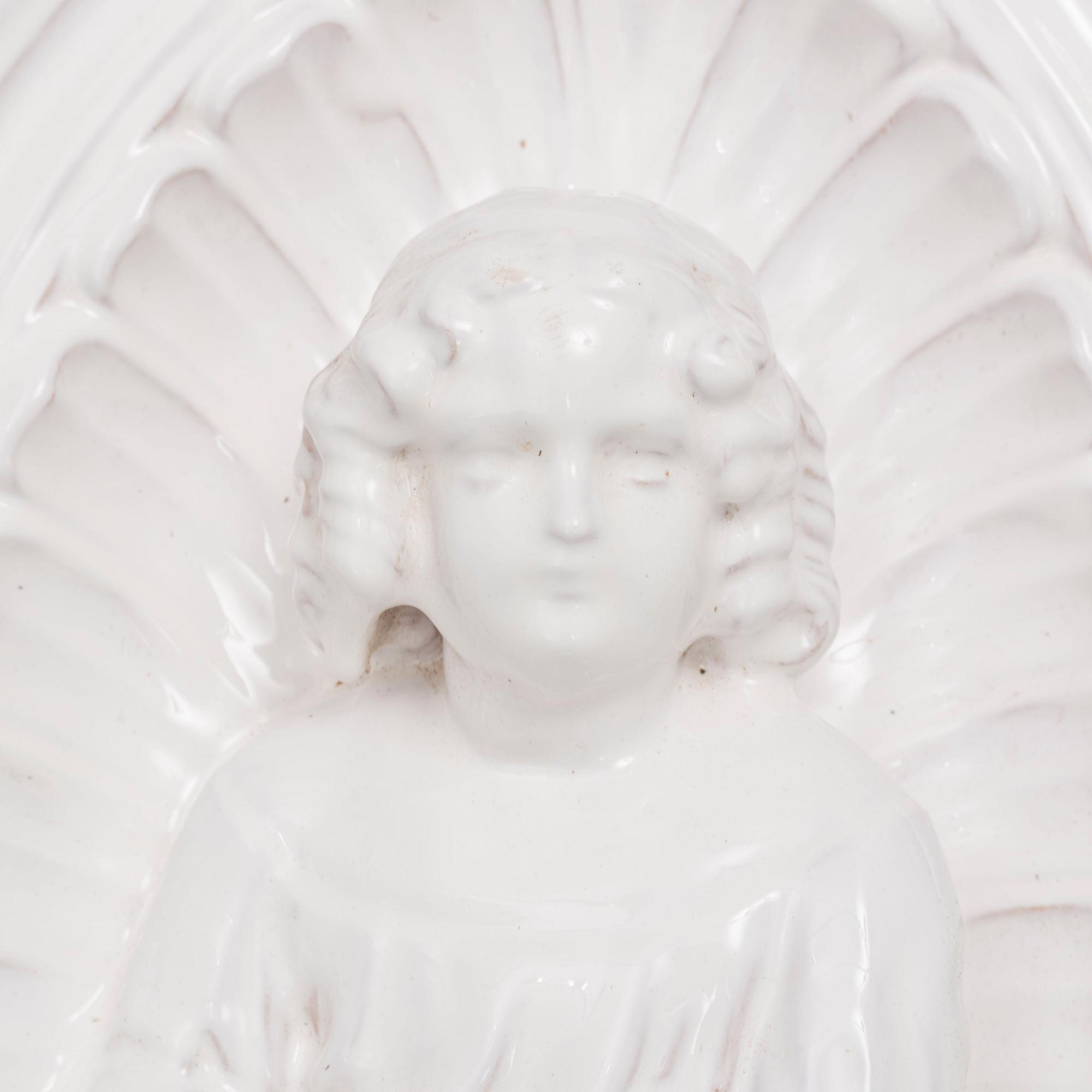 A ceramic wall relief, circa 1900.