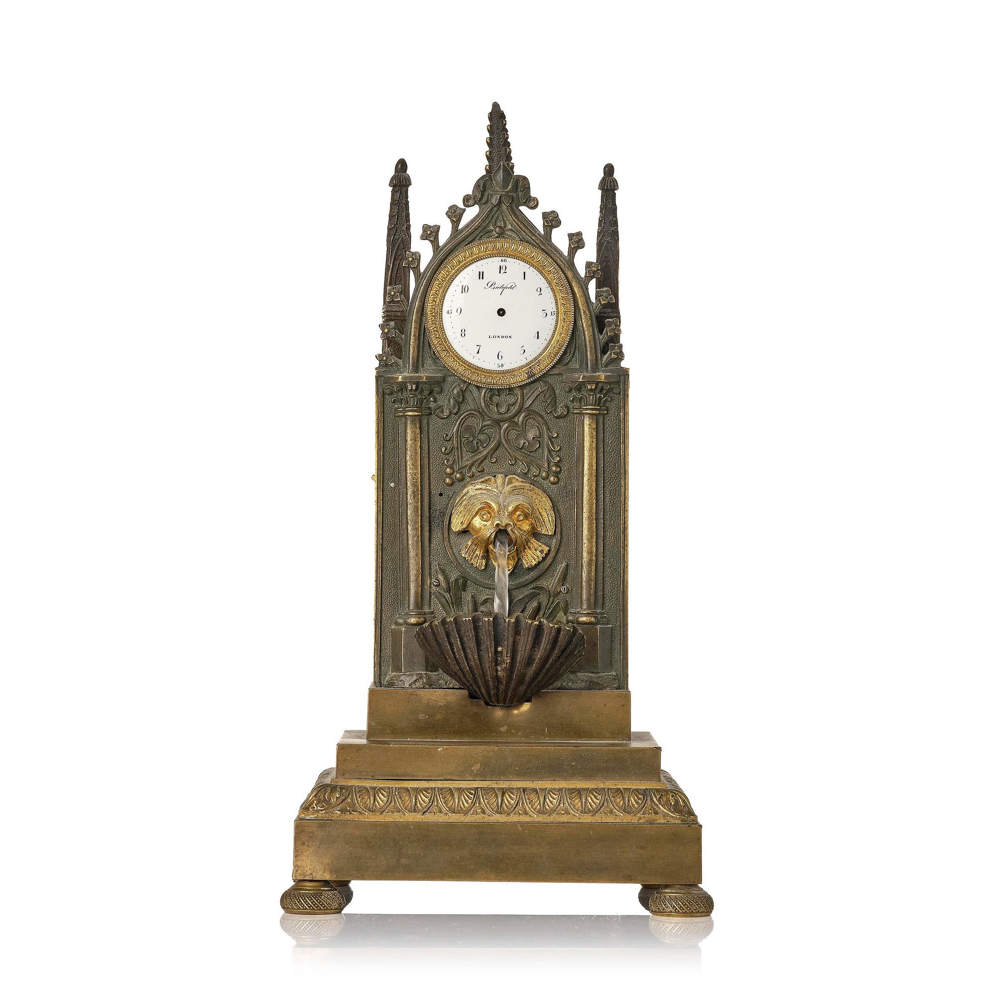 An English neo-Gothic patinated and ormolu mechanical mantel clock, ca 1820.