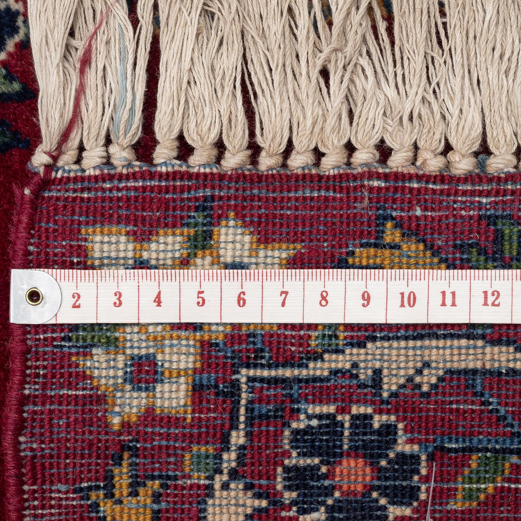 A semi-antique Keshan runner, c. 446 x 112 cm.
