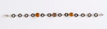 An 18K white gold bracelet with citrines, smoky quartz and diamonds.