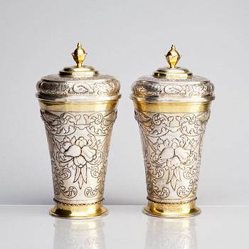 A pair of Russian Baroque parcel-gilt silver cups and covers, mark of Nikifor Timofeev, Moscow 1729.