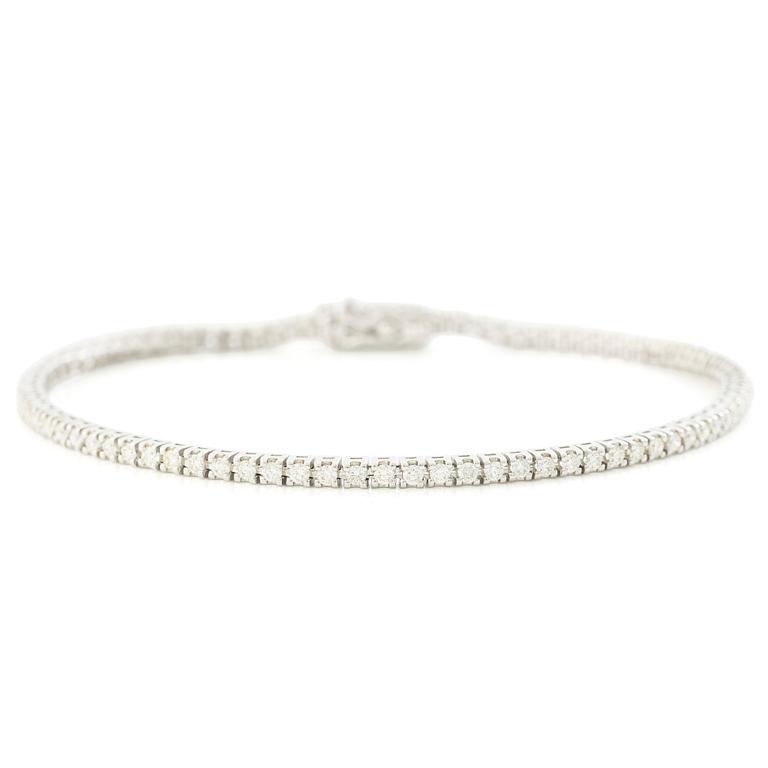 Tennisamband, 18K vitguld med briljantslipade diamanter.