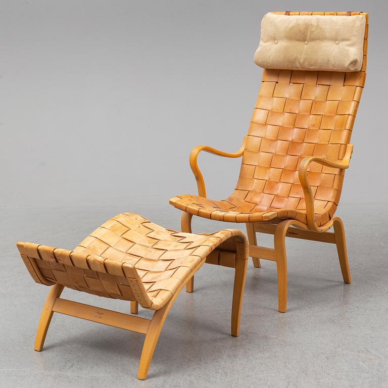 BRUNO MATHSSON, an easy chair and ottoman, Firma Karl Mathsson, Värnamo, 1978.