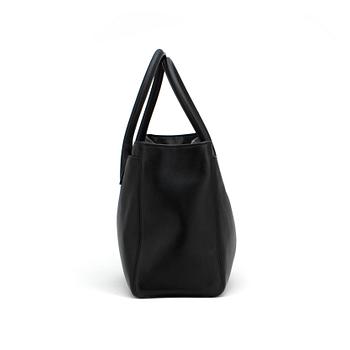 CHANEL,  a black leather bag.