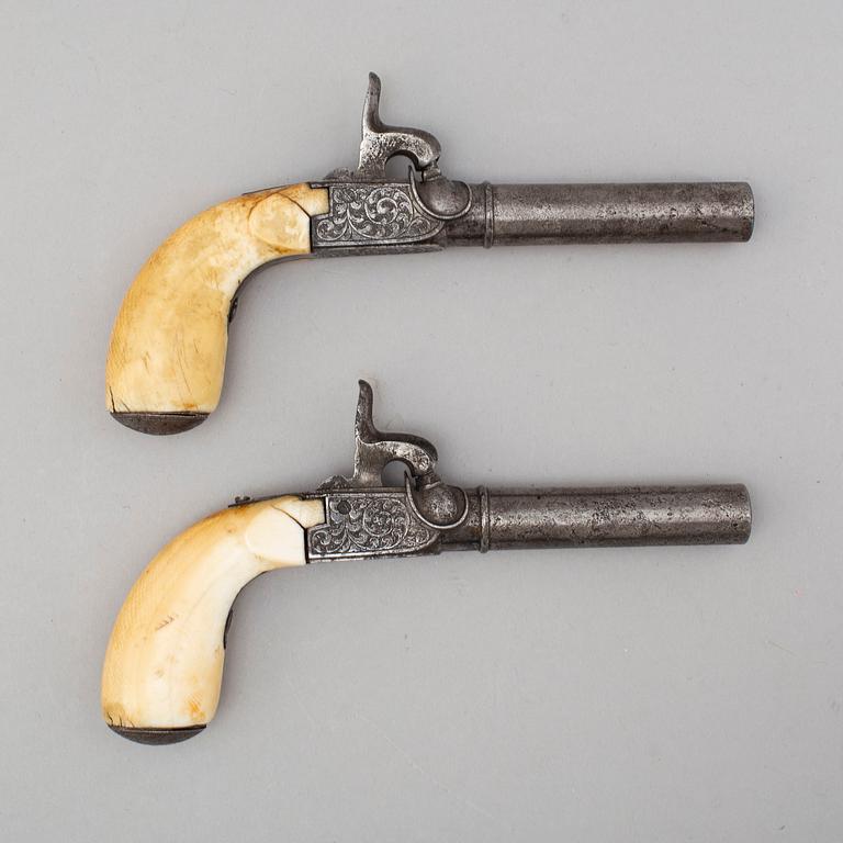 A mid 19th century Belgian rifled percussion pistols with ivory butts in a case.