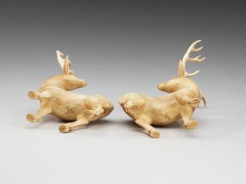 A pair of ivory figures of deers, Qing dynasty, presumably Qianlong (1736-95).