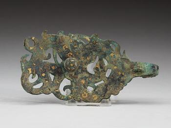 An archaistic silver gilt bronze garment hook inlayed with green stone,