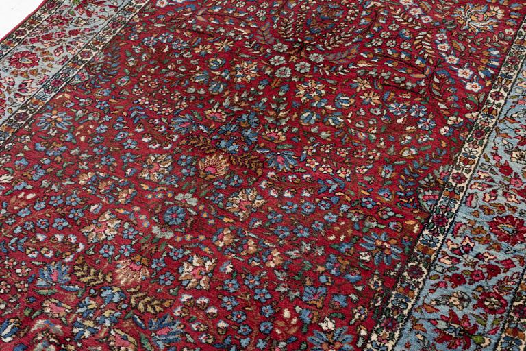 A carpet, Kerman, c. 224 x 127 cm.
