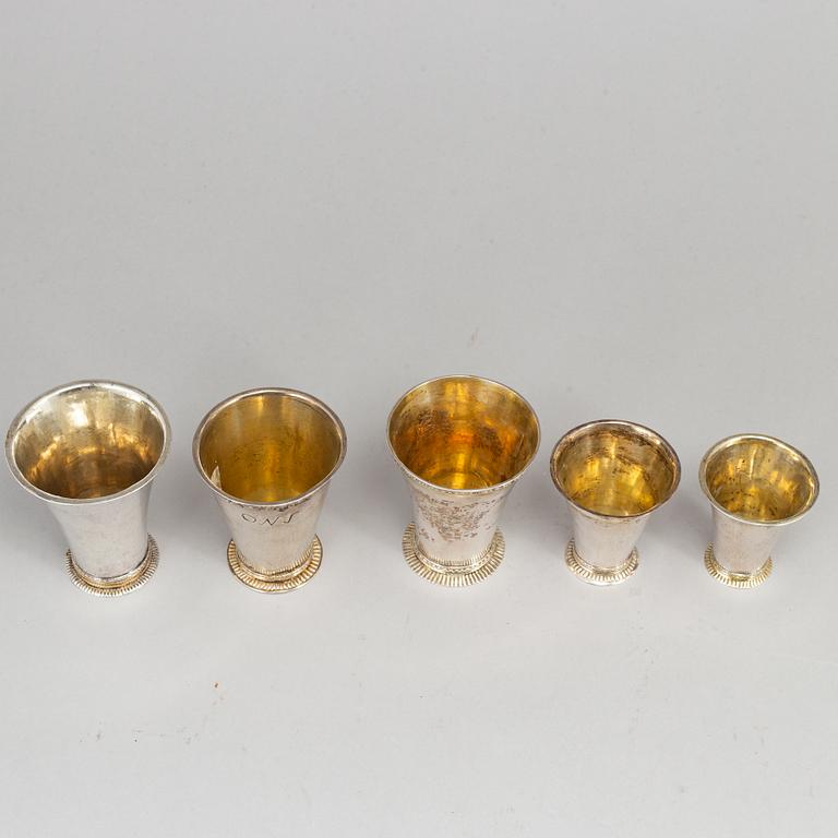 Five Swedish 18th century parcel-gilt silver beakers.